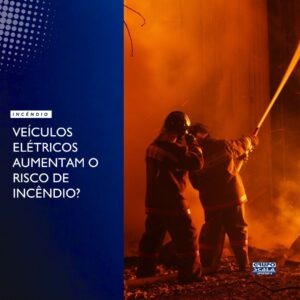Veículo elétrico em processo de carregamento em estacionamento com sistemas de segurança contra incêndio e sinalização de emergência.